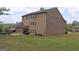 The home's backyard with an outdoor hot tub and patio with outdoor seating offers lots of space to relax at 293 Ironwood Dr, Stockbridge, GA 30281