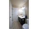 Bathroom with a modern vanity, white toilet, and well-lit mirror create a functional and stylish space at 293 Ironwood Dr, Stockbridge, GA 30281