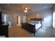 Comfortable bedroom with neutral colors, ceiling fan, and easy access to the bathroom at 293 Ironwood Dr, Stockbridge, GA 30281