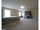 Spacious bedroom with bright windows, neutral carpet, and a charming playhouse, offering comfort and play at 293 Ironwood Dr, Stockbridge, GA 30281