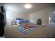 Inviting bedroom features a vibrant rug, cozy twin bed, and plush carpeting at 293 Ironwood Dr, Stockbridge, GA 30281