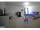 Comfortable bedroom with a playful rug, twin bed, dresser, and carpeted floors at 293 Ironwood Dr, Stockbridge, GA 30281