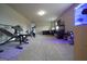 Home gym with exercise equipment and weights providing a dedicated space for fitness and wellness at 293 Ironwood Dr, Stockbridge, GA 30281