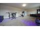 Home gym featuring weightlifting equipment and a stationary bike creating an inspiring fitness space at 293 Ironwood Dr, Stockbridge, GA 30281