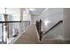 Open hallway with carpet and railing showcasing an archway at 293 Ironwood Dr, Stockbridge, GA 30281