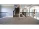 Upper level hallway with carpet and railing provides access to the staircase at 293 Ironwood Dr, Stockbridge, GA 30281
