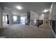 Spacious upper level hallway with carpet, railing, and archways to other rooms at 293 Ironwood Dr, Stockbridge, GA 30281