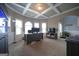 The bright home office has a tray ceiling, large windows and an aquarium at 293 Ironwood Dr, Stockbridge, GA 30281