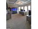 The bright home office has a tray ceiling, large windows and an aquarium at 293 Ironwood Dr, Stockbridge, GA 30281