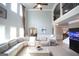 Bright living room with soaring ceilings, a large sectional sofa, and an upstairs landing at 293 Ironwood Dr, Stockbridge, GA 30281