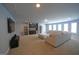 Large living room featuring a wet bar, plush carpet, neutral paint, and a comfortable sectional sofa at 293 Ironwood Dr, Stockbridge, GA 30281
