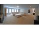 Expansive living room with plush carpeting, neutral-toned walls, and a large sectional sofa perfect for relaxation at 293 Ironwood Dr, Stockbridge, GA 30281