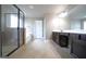 Well-lit main bathroom features a stand-up shower, soaking tub, and double vanity at 293 Ironwood Dr, Stockbridge, GA 30281