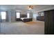 Large main bedroom featuring a king bed, ample closet space, and neutral walls and carpet at 293 Ironwood Dr, Stockbridge, GA 30281
