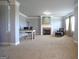 Sitting area with fireplace in the main bedroom of home, including neutral walls and carpet at 293 Ironwood Dr, Stockbridge, GA 30281