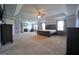 Expansive main bedroom featuring a fireplace, ceiling fan, and large windows for ample natural light at 293 Ironwood Dr, Stockbridge, GA 30281