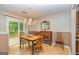 Cozy dining room with wood floors, chandelier, and sliding glass door at 44 Twiggs Cor, Peachtree City, GA 30269
