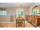 Bright dining room with wooden table, chairs, and a view to the outside at 44 Twiggs Cor, Peachtree City, GA 30269
