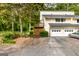 Two-story townhome with a two-car garage in a wooded community at 44 Twiggs Cor, Peachtree City, GA 30269