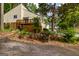 Scenic view of the home with mature trees and beautifully landscaped yard at 44 Twiggs Cor, Peachtree City, GA 30269
