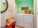 Convenient laundry area with modern washer, dryer, and shelving at 44 Twiggs Cor, Peachtree City, GA 30269