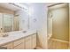 Bathroom features double vanity, shower-tub combo and large mirror at 1643 Jackson Way, Atlanta, GA 30318