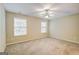 Inviting carpeted bedroom bathed in natural light with ceiling fan at 1643 Jackson Way, Atlanta, GA 30318