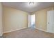 Neutral-toned carpeted bedroom with access door and ample wall space at 1643 Jackson Way, Atlanta, GA 30318