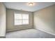 Bright bedroom with a window, neutral carpet, and ample wall space at 1643 Jackson Way, Atlanta, GA 30318
