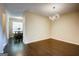 Open dining room with modern lighting and dark hardwood floors at 1643 Jackson Way, Atlanta, GA 30318