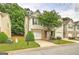 Charming townhome featuring a well-maintained front yard and a one-car garage at 1643 Jackson Way, Atlanta, GA 30318