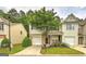 Charming townhome featuring a well-maintained front yard and a one-car garage at 1643 Jackson Way, Atlanta, GA 30318
