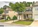 Charming townhome featuring a well-maintained front yard and a one-car garage at 1643 Jackson Way, Atlanta, GA 30318