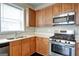 Modern kitchen featuring stainless steel appliances and light countertops at 1643 Jackson Way, Atlanta, GA 30318