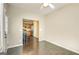 Bright living room with wood floors open to modern kitchen with stainless appliances and bar stool seating at 1643 Jackson Way, Atlanta, GA 30318