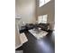 Bright living room with high ceilings, fireplace, dark floors, and modern decor at 1643 Jackson Way, Atlanta, GA 30318