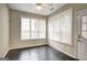 Bright sunroom with hardwood floors, multiple windows, and a ceiling fan at 1643 Jackson Way, Atlanta, GA 30318