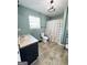 Bathroom featuring window with a curtain, sink, toilet, and shower at 3014 Bowdon Tyus Rd, Bowdon, GA 30108