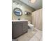 Bathroom with marble tile flooring, shower, mirror, and sink at 3014 Bowdon Tyus Rd, Bowdon, GA 30108