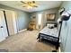 Cozy bedroom features carpet, closet, and a unique single bed with blue bedding at 3014 Bowdon Tyus Rd, Bowdon, GA 30108