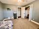 Carpeted bedroom with closet and view of the doorway, with shark blanket at 3014 Bowdon Tyus Rd, Bowdon, GA 30108