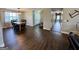 Open-concept living space with modern flooring, dining area, and views into a well-lit hallway at 3014 Bowdon Tyus Rd, Bowdon, GA 30108