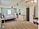 Spacious main bedroom featuring carpet, ceiling fan, with ensuite bathroom at 3014 Bowdon Tyus Rd, Bowdon, GA 30108