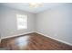 Bedroom with hardwood floors and neutral walls at 616 Inman Rd # B, Fayetteville, GA 30215