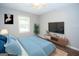 Bedroom with ceiling fan and stylish decor at 616 Inman Rd # B, Fayetteville, GA 30215