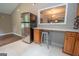 Bright kitchen featuring a stainless steel refrigerator and a bar open to another room at 616 Inman Rd # B, Fayetteville, GA 30215