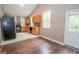 Kitchen featuring wooden cabinets, black appliances, and a door leading to the back deck at 616 Inman Rd # B, Fayetteville, GA 30215