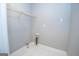 Utility room with tile flooring and simple fixtures; ready for washer and dryer hookup at 616 Inman Rd # B, Fayetteville, GA 30215