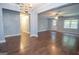 Open-concept living area with hardwood floors, open view to the other rooms, and natural light at 616 Inman Rd # B, Fayetteville, GA 30215