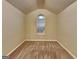 Angled bedroom with carpet and window, painted in neutral colors at 6630 Pole Creek Dr, Lithonia, GA 30058